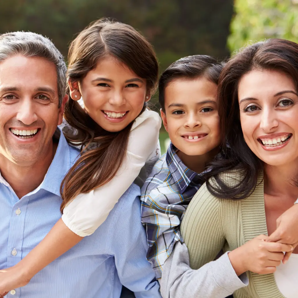 Portrait Of Hispanic Family In Countryside